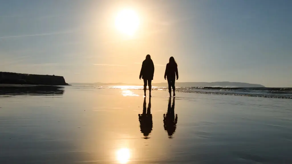 Two people walking and talking
